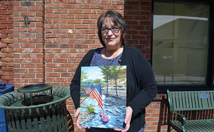 Rebecca Carfizzi’s painting, “Fourth of July in Helen” won this year’s Scoop cover contest. (Photo/Samantha Sinclair)